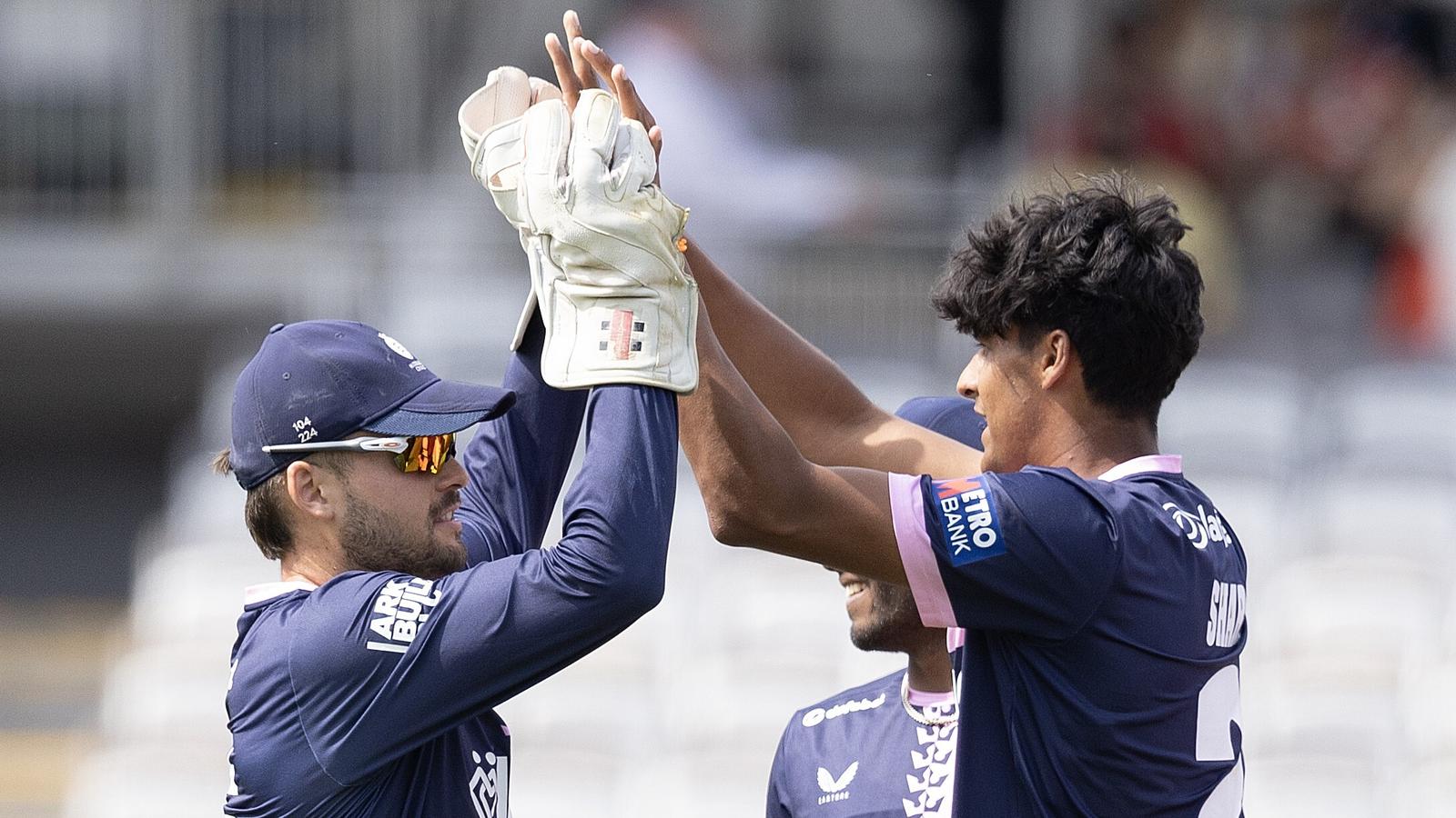 Middlesex's Naavya Sharma (R) celebrates a wicket against Yorkshire with wicketkeeper Joe Cracknell