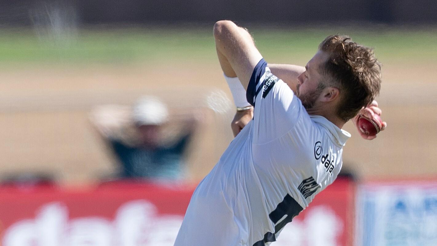 Middlesex's Tom Helm bowling against Kent