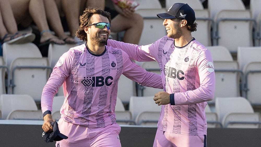 Middlesex fielders Max Holden (L) and Josh de Caires combine for a boundary catch against Hampshire in the Vitality Blast