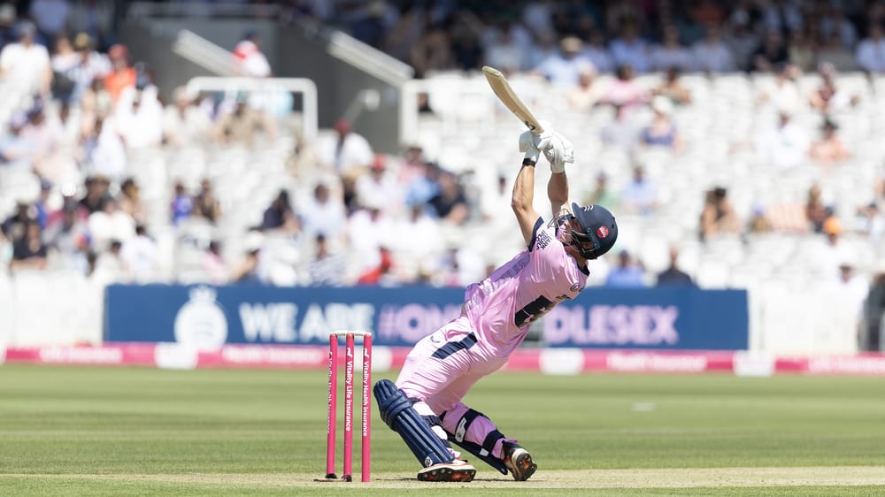 Middlesex's Luke Hollman attempts an unusual shot against Surrey in the Vitality Blast