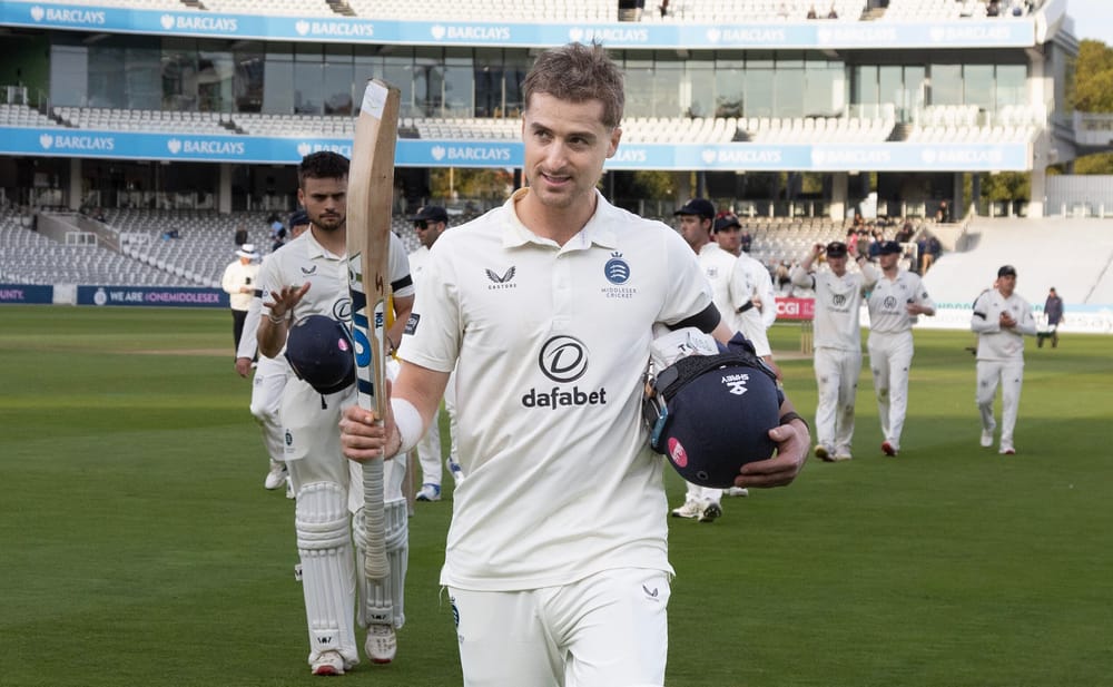 Leus du Plooy raises his bat at the close of play against Gloucestershire