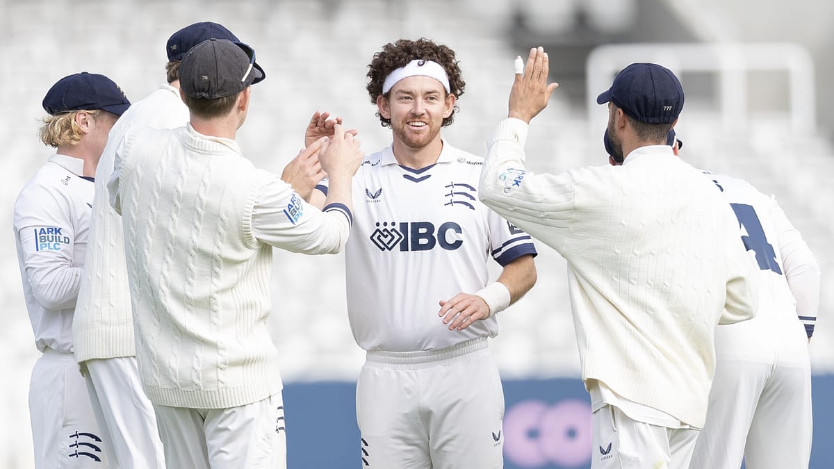 Middlesex's Ryan Higgins (C) celebrates a wicket against Northamptonshire
