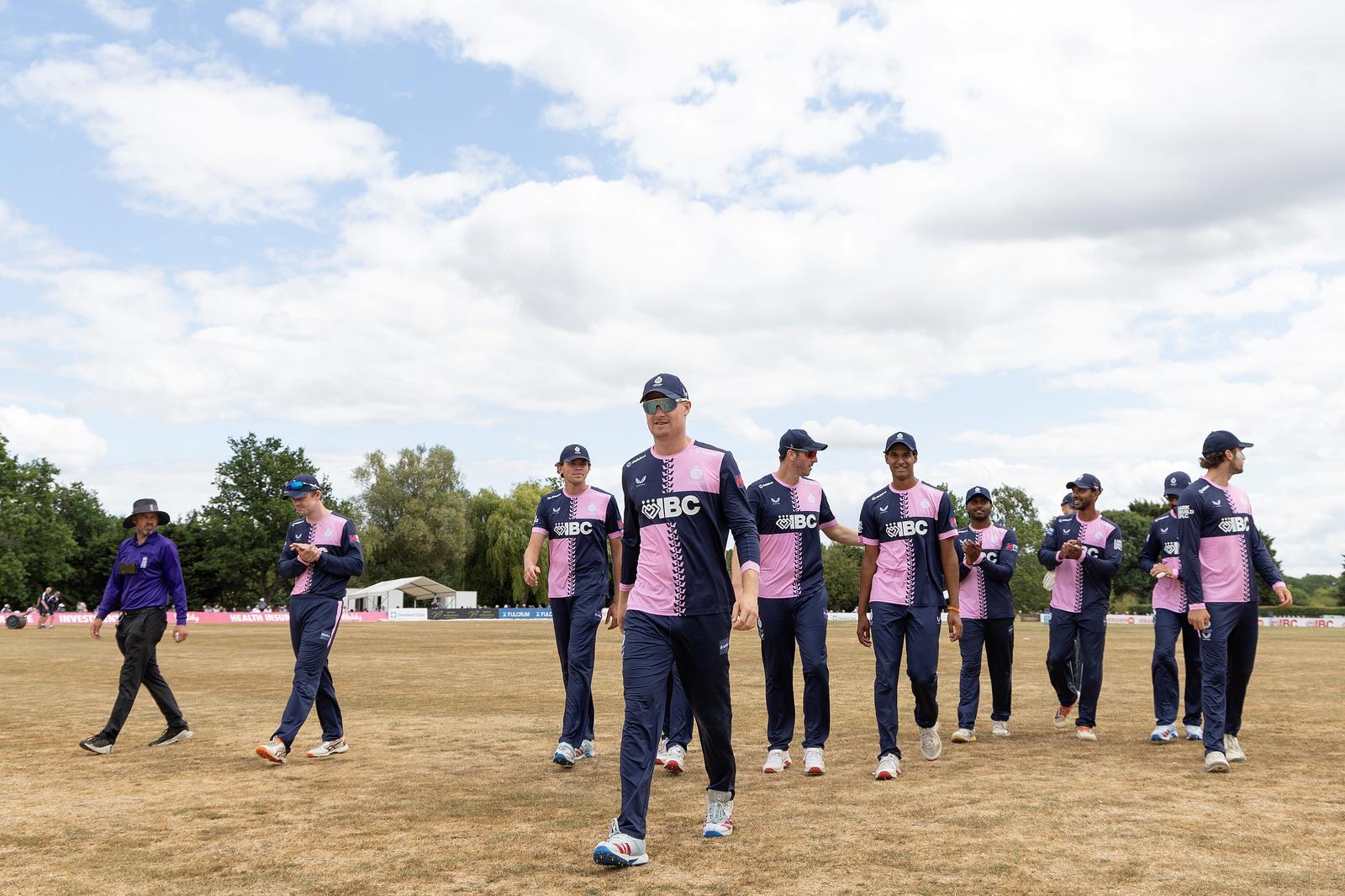 Ben Geddes leads the team from the field at Radlett after another Metro Bank One-Day Cup triumph