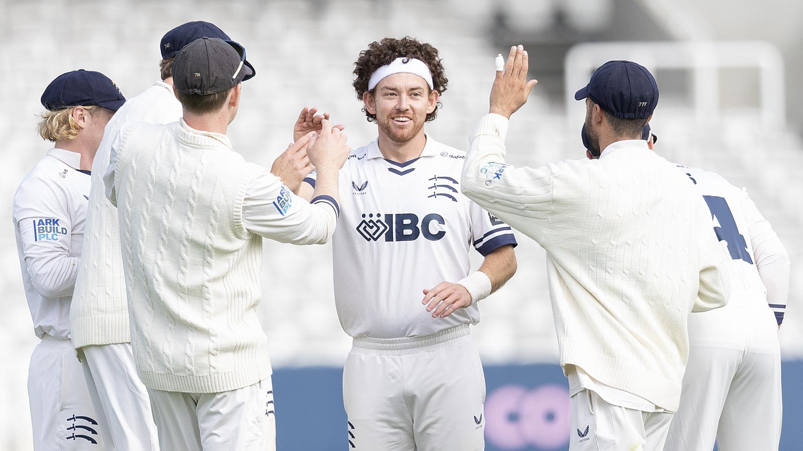 Middlesex's Ryan Higgins (C) celebrates a wicket against Northamptonshire