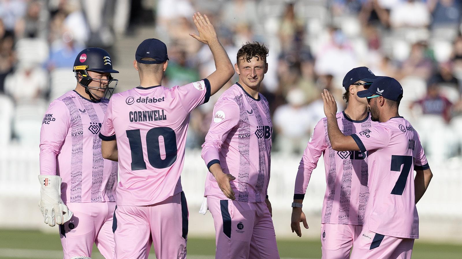 Middlesex's Luke Hollman (C) celebrates a wicket against Kent in the Vitality Blast