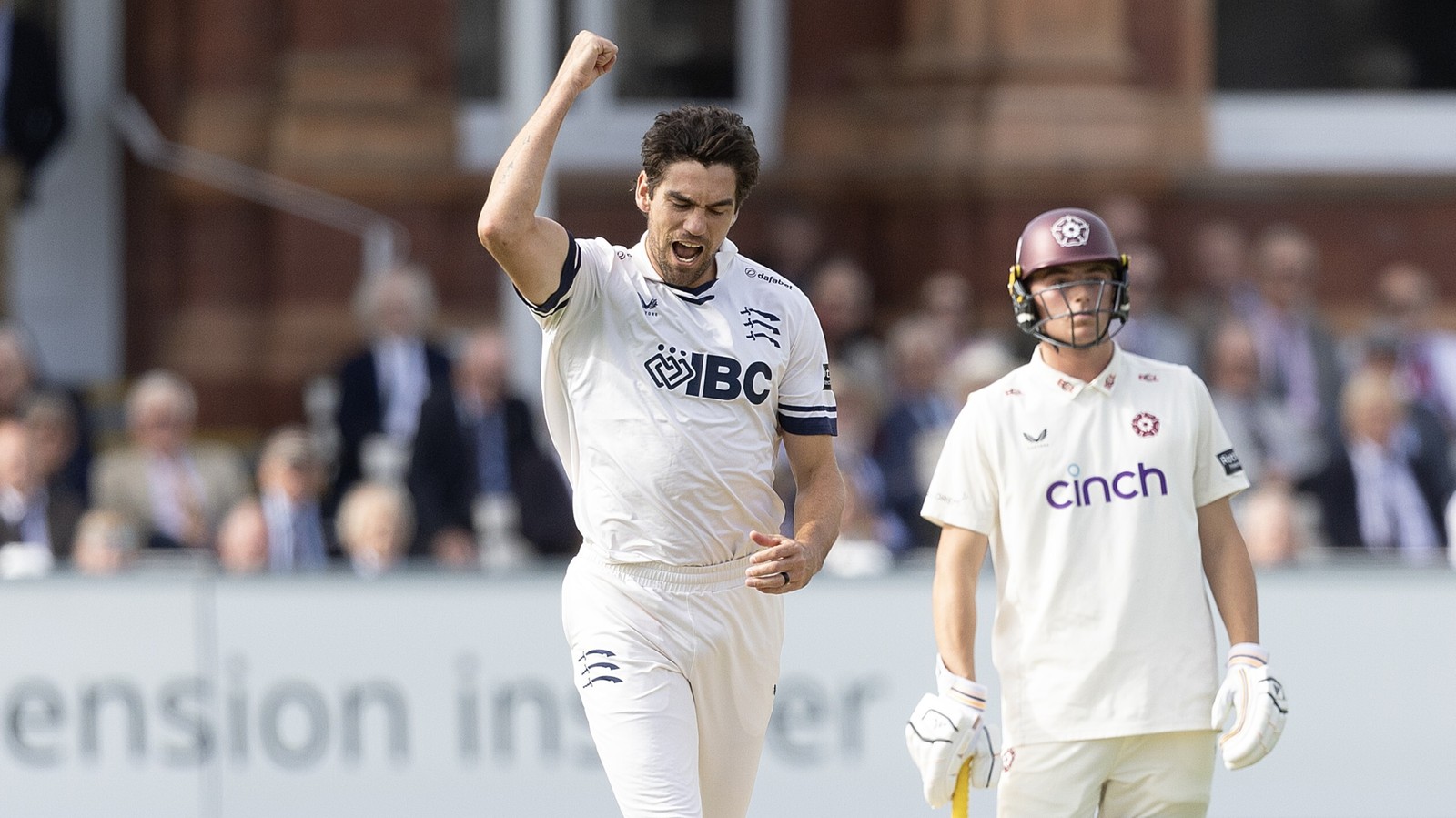 Middlesex bowler Danru Ferns celebrates taking the wicket of Northamptonshire's Ricardo Vasconcelos