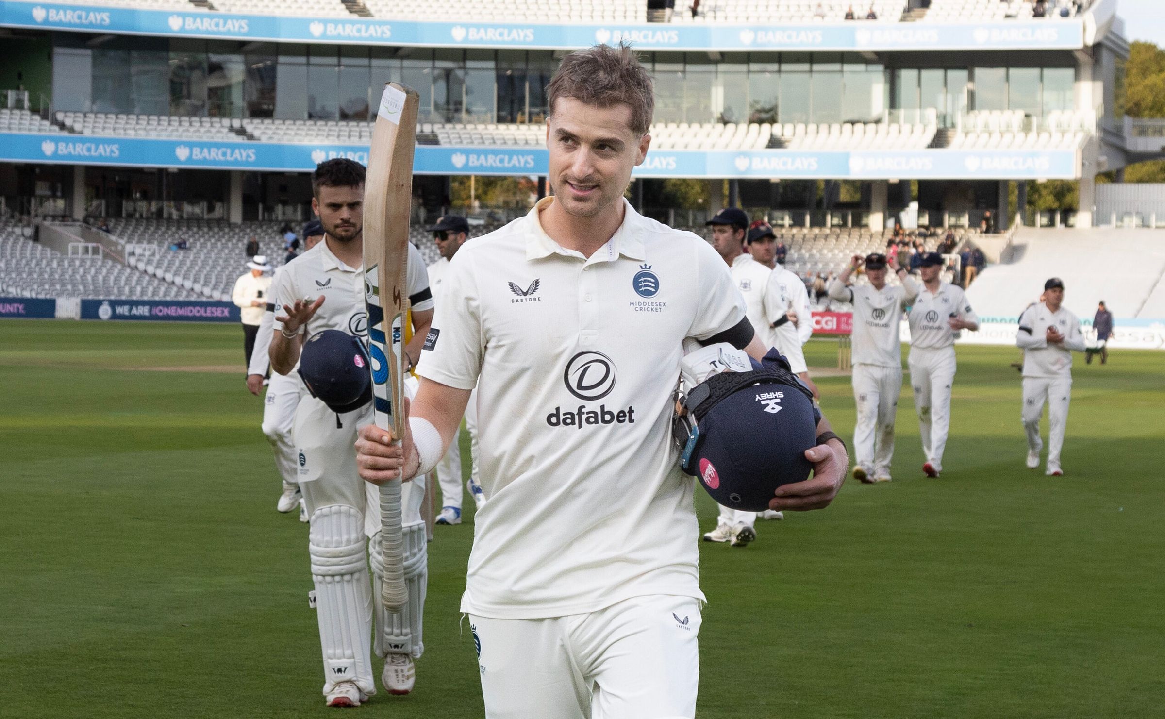 Leus du Plooy raises his bat at the close of play against Gloucestershire