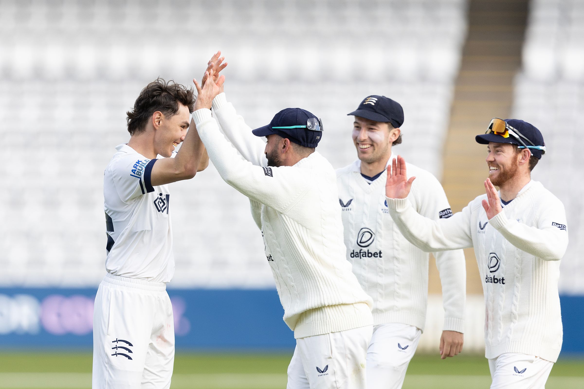 Sebastian Morgan (L) celebrates a wicket against Gloucestershire
